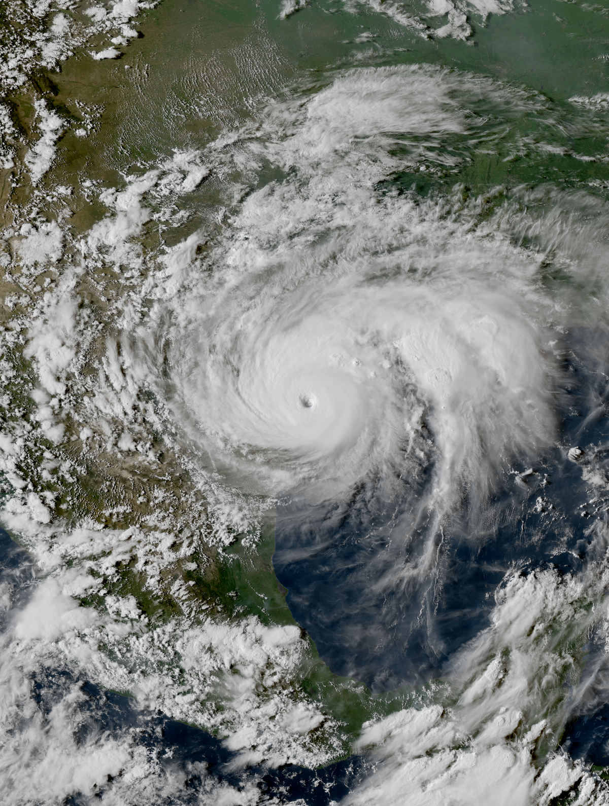 Why hurricanes tend to move west across the Atlantic then turn northeast up the US east coast?